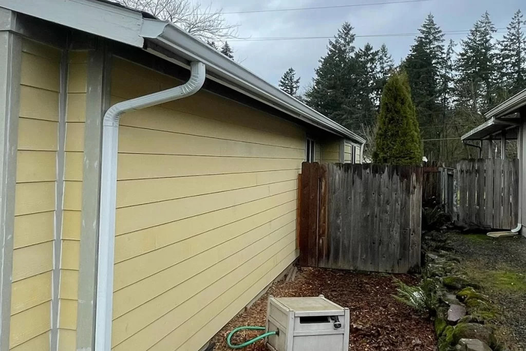 new-white-gutter-on-yellow-house