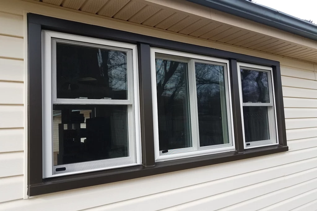 newly-installed-windows-on-white-house-with-black-trim