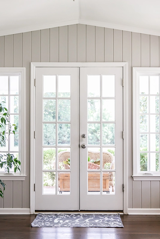 white-french-doors-leading to backyard