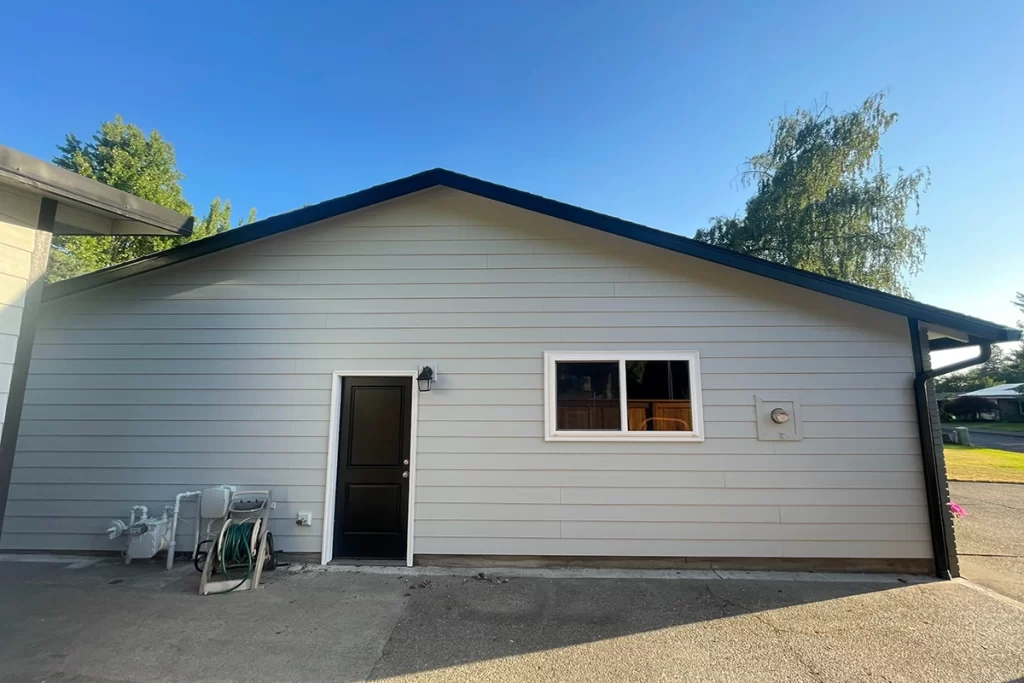 freshly-painted-grey-house-with-blue-trim