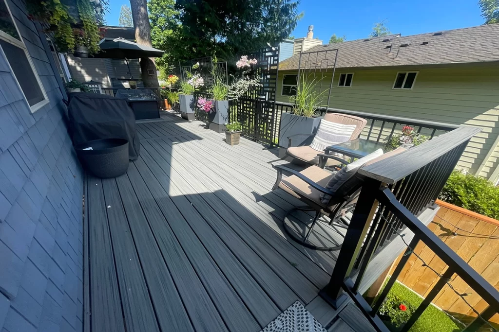 new-grey-deck-with-black-railing-and-furniture