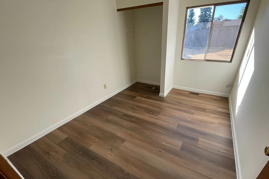new-plank-flooring-installed-in-bedroom