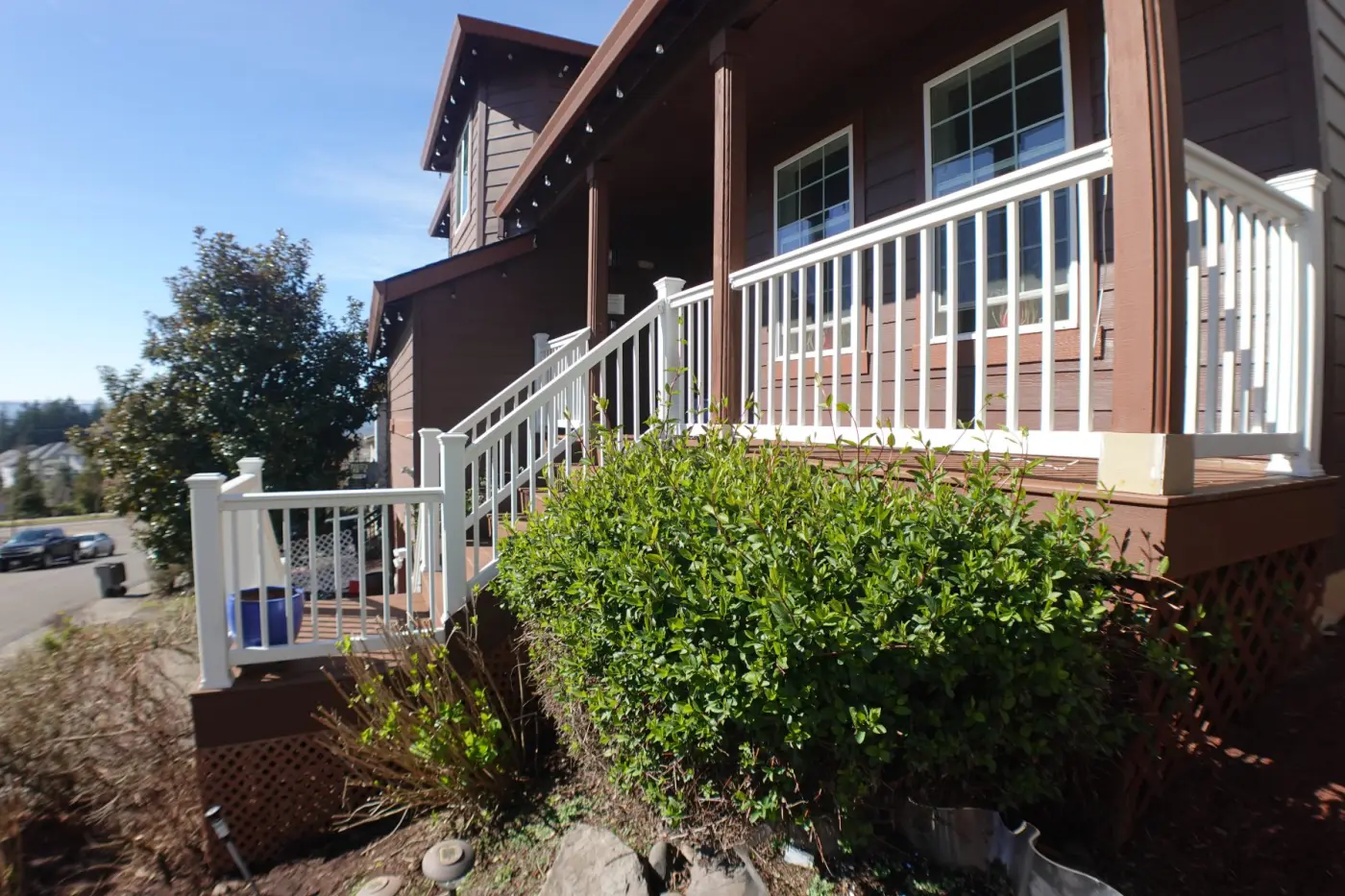 Deck with white railings and stairs